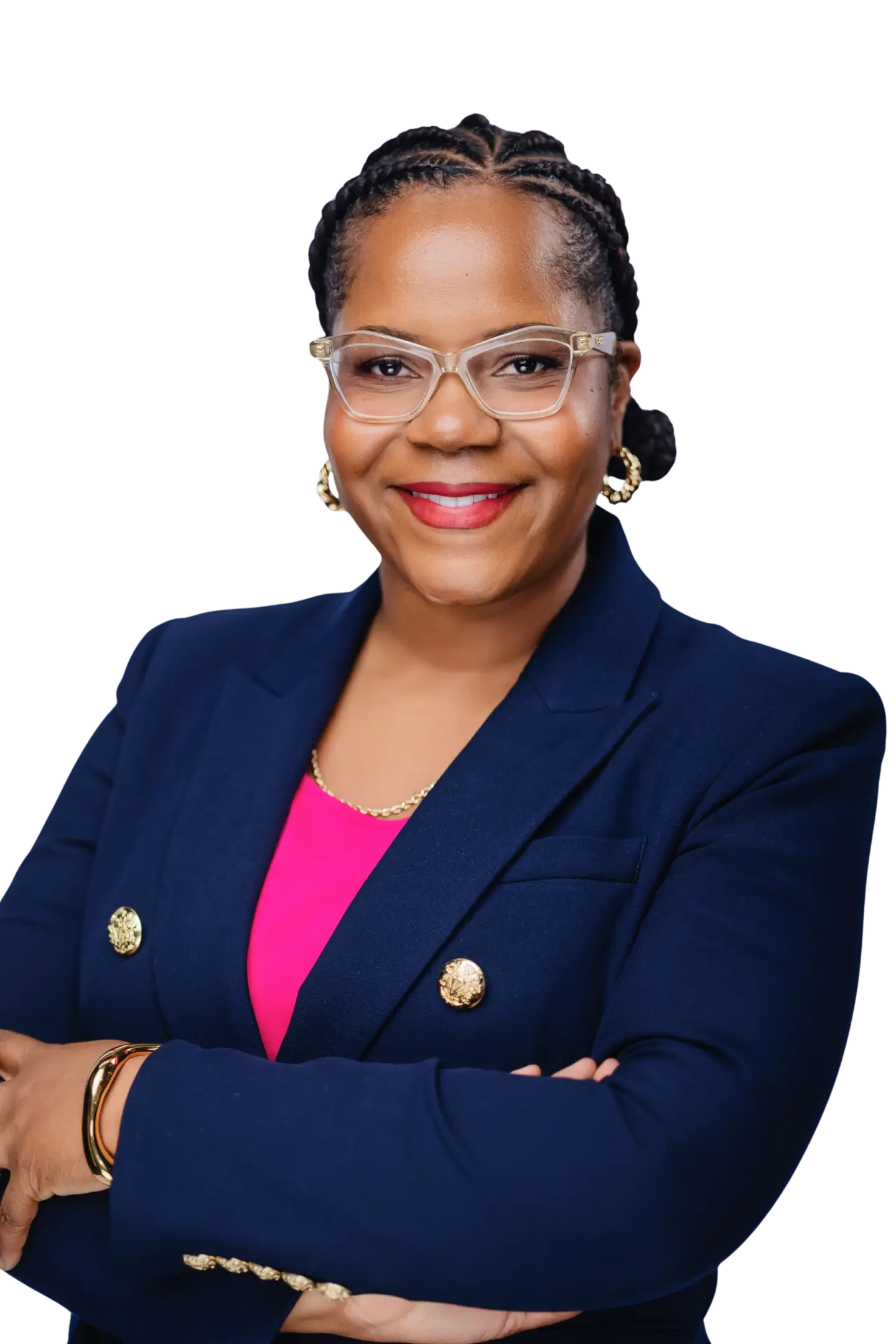 Professional woman in a navy blazer and pink top smiling confidently.